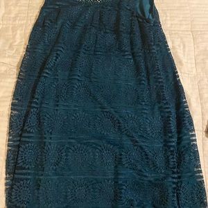 Emerald knee length dress with bejeweled neckline and accompanying sheer shawl